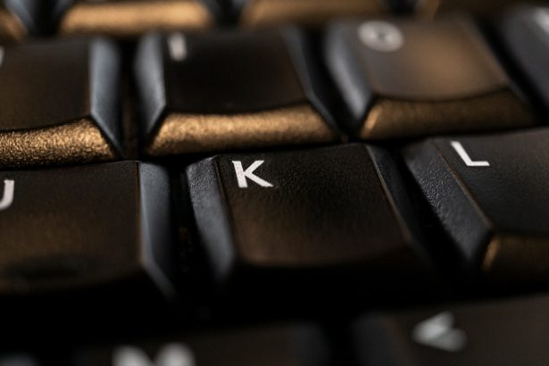 black computer keyboard on brown wooden table